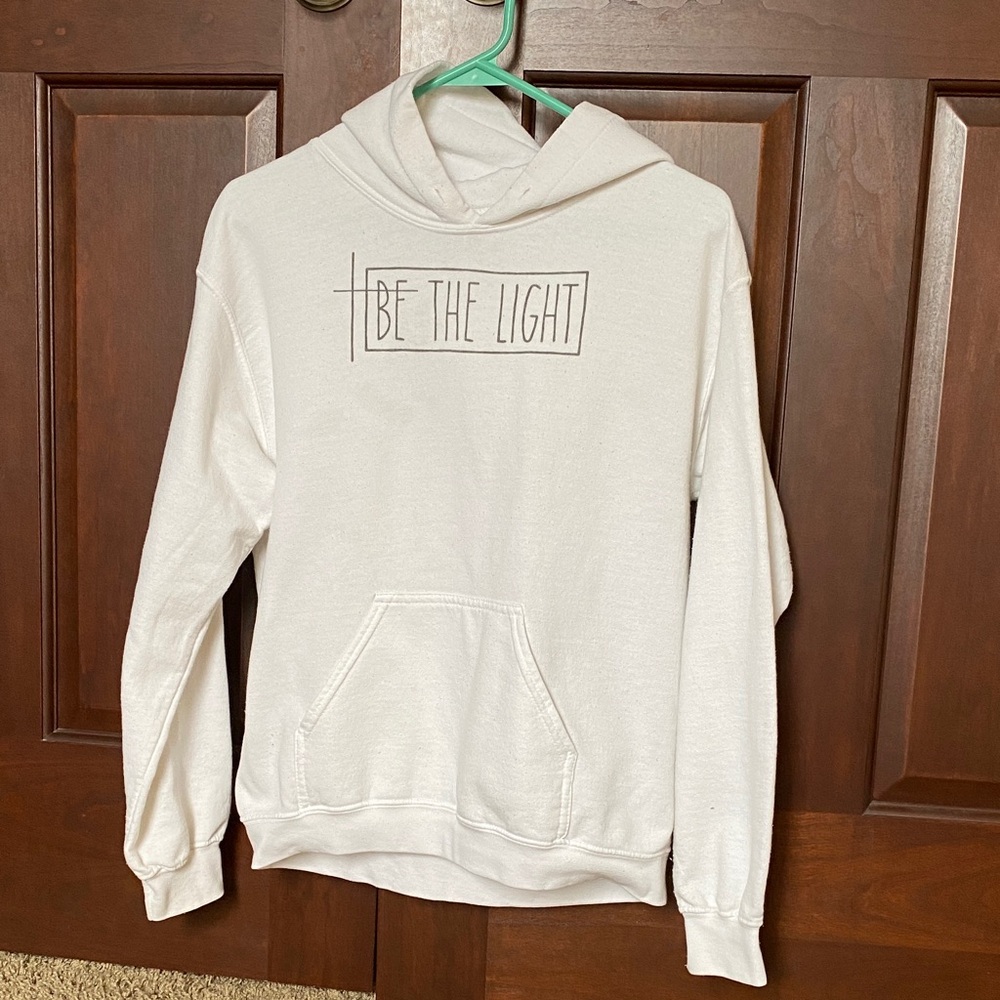 White Hoodie with 'Be The Light' Graphic